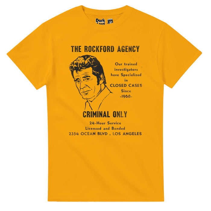 A bright yellow, retro 70s style short sleeved t-shirt that says "The Rockford Agency", "Our trained investigators have Specialized in CLOSED CASES Since -1968-", "CRIMINAL ONLY", "24-Hour Service, Licensed and Bonded, 2354 OCEAN BLVD, LOS ANGELES" with an image of character Jim Rockford, played by the iconic actor James Garner. References the American detective drama tv series "The Rockford Files" from the 1970s created by Roy Huggins and Stephen J. Cannell.