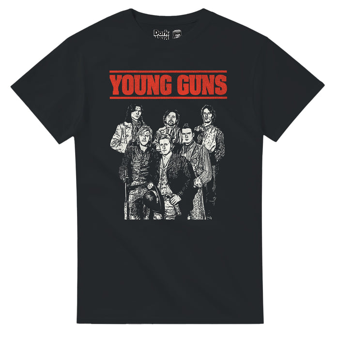 A vintage, black colored souvenir t-shirt that says "Young Guns" in bold red letters, underlined with a line on top as well, with the image of six people wearing suits and trenchcoats in a black and white graphic sketched image. References the iconic 1988 western action film "Young Guns", a reimagining of the myth of Billy the Kid, which starred Emilio Estevez, Kiefer Sutherland, Lou Diamond Phillips, Charlie Sheen, Dermot Mulroney, and Casey Siemaszko.