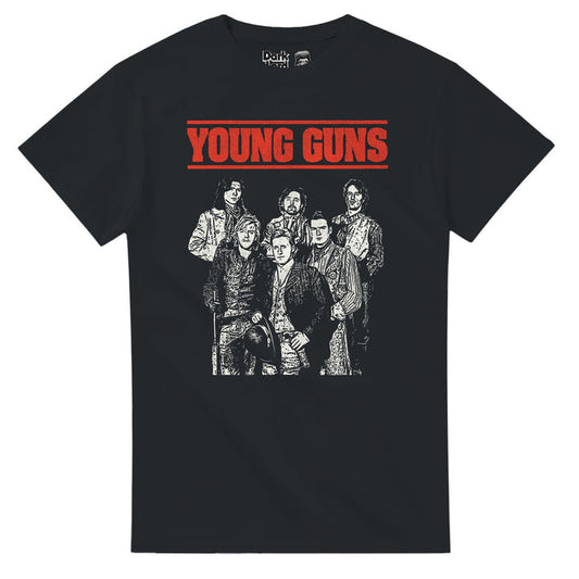 A vintage, black colored souvenir t-shirt that says "Young Guns" in bold red letters, underlined with a line on top as well, with the image of six people wearing suits and trenchcoats in a black and white graphic sketched image. References the iconic 1988 western action film "Young Guns", a reimagining of the myth of Billy the Kid, which starred Emilio Estevez, Kiefer Sutherland, Lou Diamond Phillips, Charlie Sheen, Dermot Mulroney, and Casey Siemaszko.