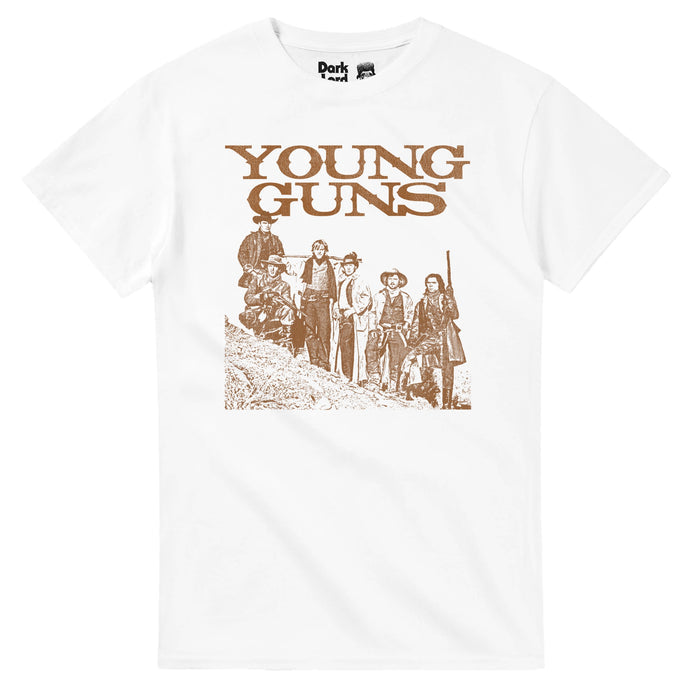 A retro, white colored Young Guns souvenir t-shirt with a sepia toned brown and white image of six men standing on the side of a hill wearing cowboy hats, trench coats, boots, some carrying guns. References the American western action film Young Guns, directed and produced by Christopher Cain, centering on the myth of Billy the kid & the Regulators in the Lincoln County War in New Mexico, starring Emilio Estevez, Kiefer Sutherland, Lou Diamond Phillips, Dermot Mulroney, Charlie Sheen, & Casey Si